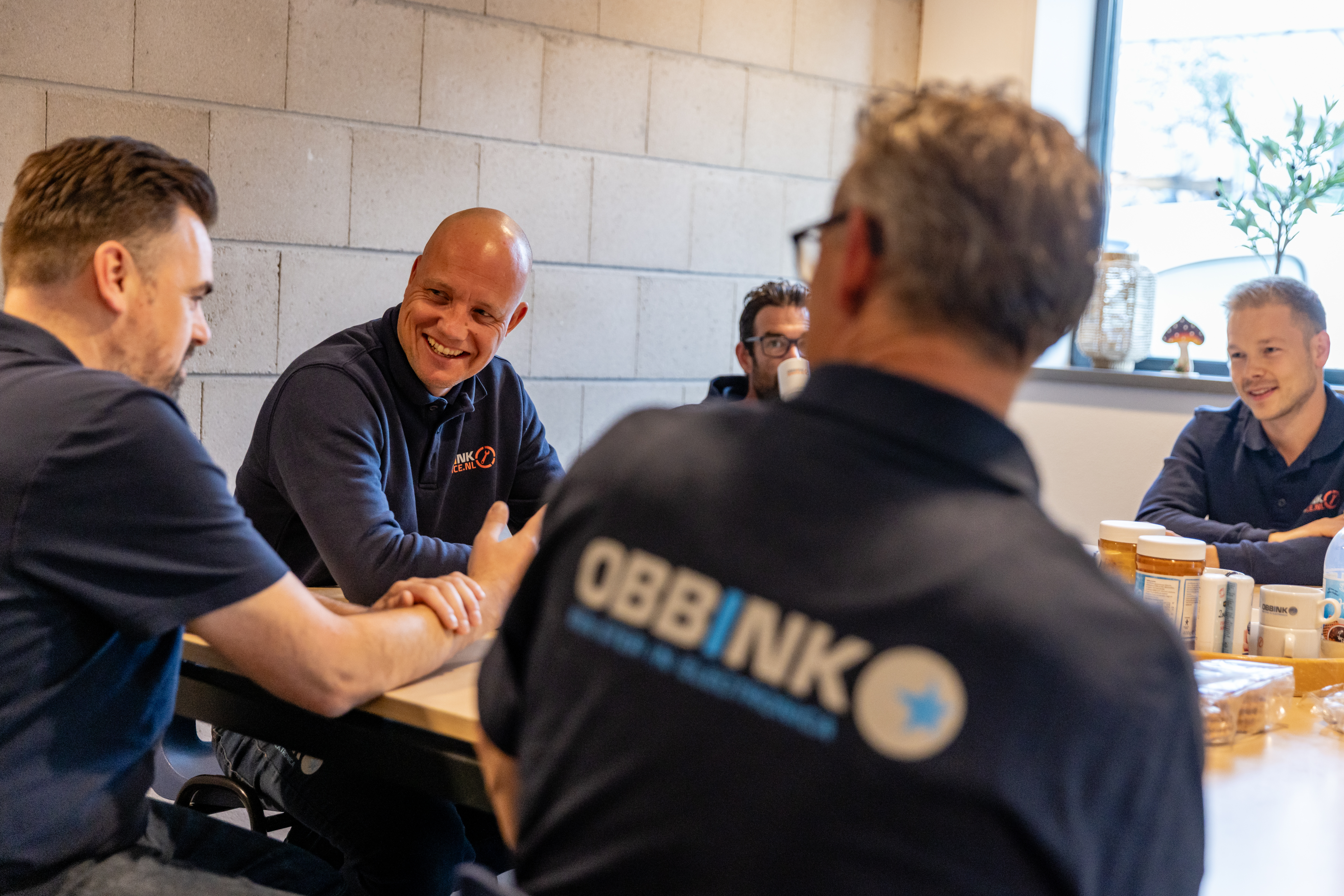 Overleg tussen medewerkers van Obbink Service